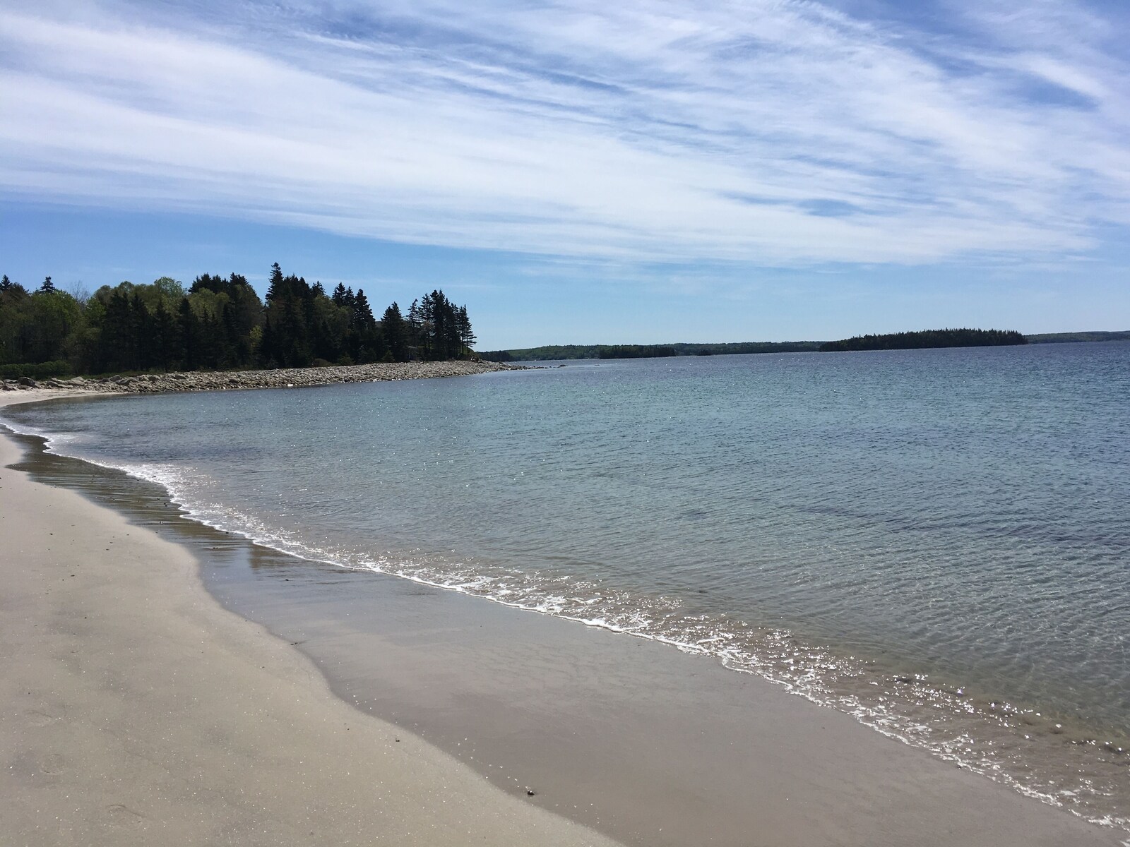 Sandy shore and water at Snairs Beach
